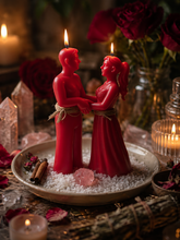 Load image into Gallery viewer, Realistic spell casting altar with red male and female figure candles tied together, surrounded by salt, rose petals, crystals and candlelight for a friend to lover love spell ritual