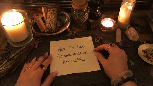 People calmly discussing at a table, showing how to keep communication respectful with attentive listening and kind body language