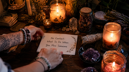 No contact: what to do when you miss someone, a person sitting alone and looking at their phone, feeling emotional and reflective