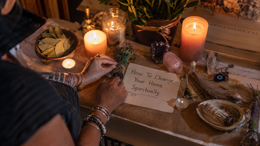 A person cleansing a cozy living room with sage and crystals, showing how to cleanse your home spiritually for a peaceful space
