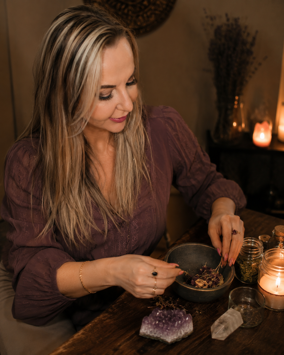 Belinda preparing herbs and candles for the Keep Your Lover Faithful Spell in a private candlelit ritual room